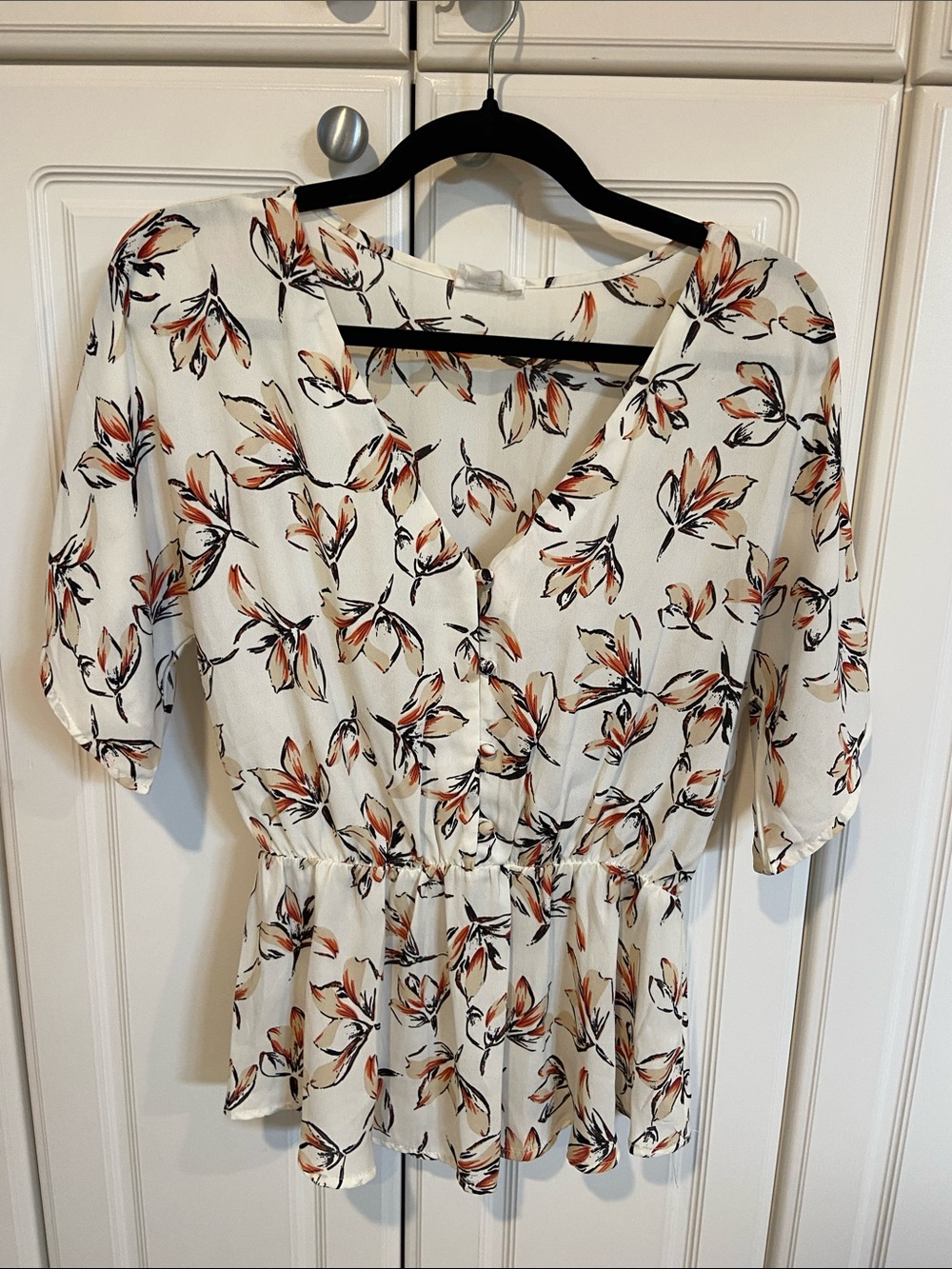 Floral V-Neck Peplum Blouse in Cream with Orange & Black Accents
